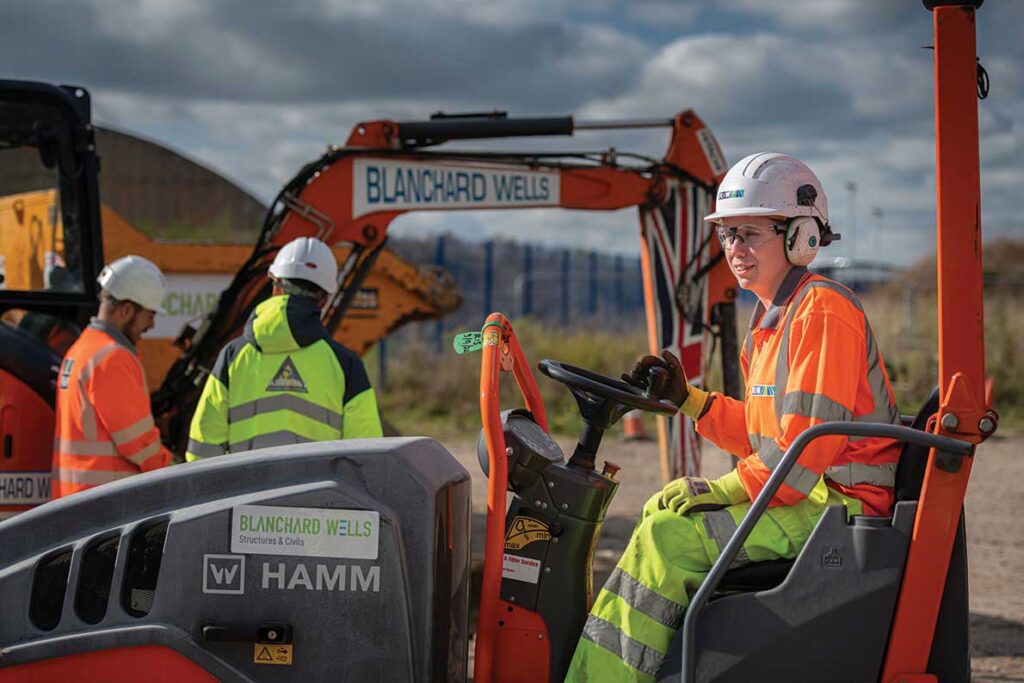 A trainee CETC apprentice learning to operate a shovel loader.