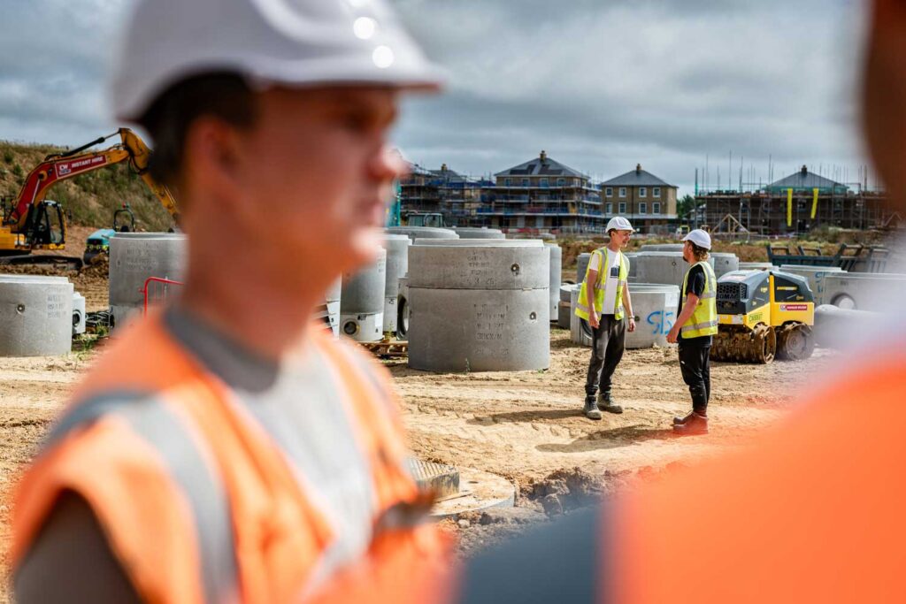 Groundworkers in both the foreground and background, what do groundworkers do?